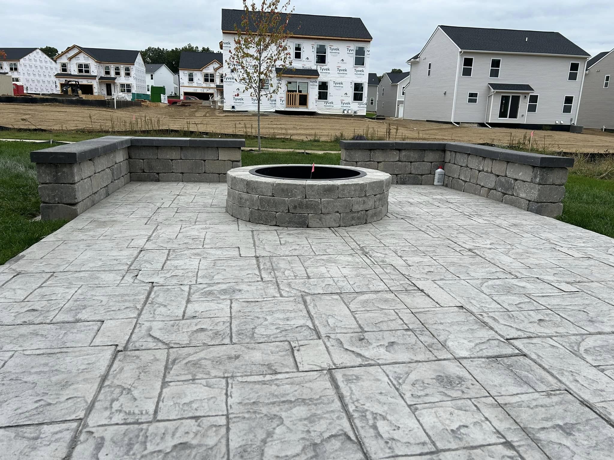 Hardscaping project with stone patio and firepit