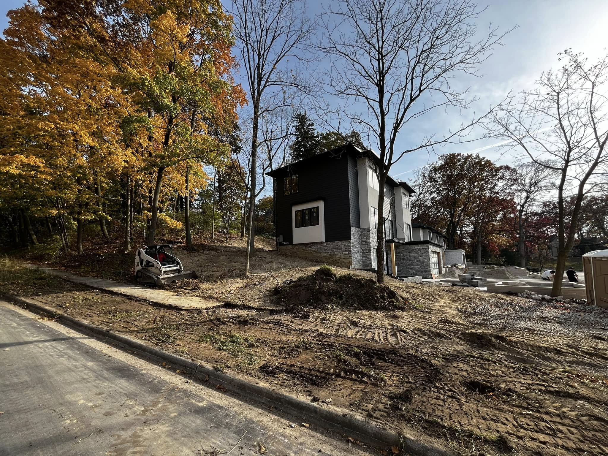 Preparation and grading, creating a foundation for a seamless integration of nature and modern home design.